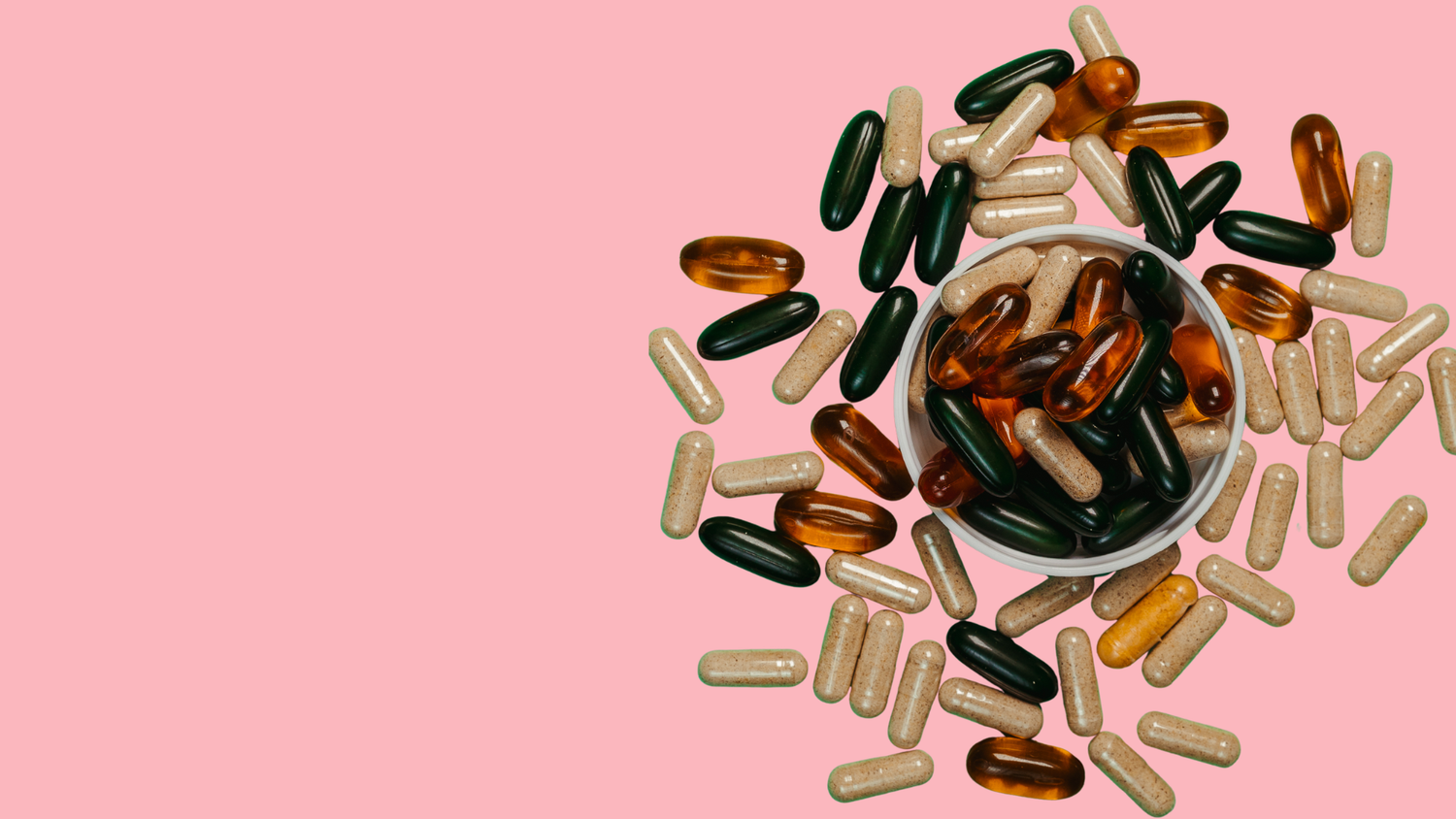 Different types of capsule in and around a bowl