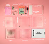 Pro Series 100 hole capsule filler with all parts laid out on a pink background